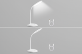 White LED desk lamp with USB cable on a gray background